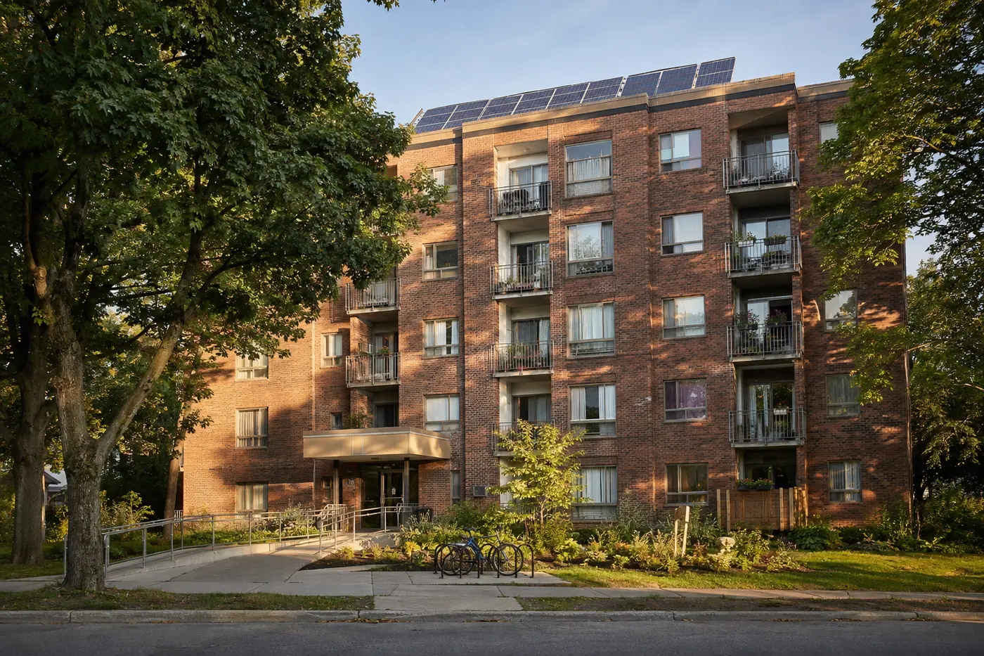 Representative brick apartment building with balconies and mature trees
